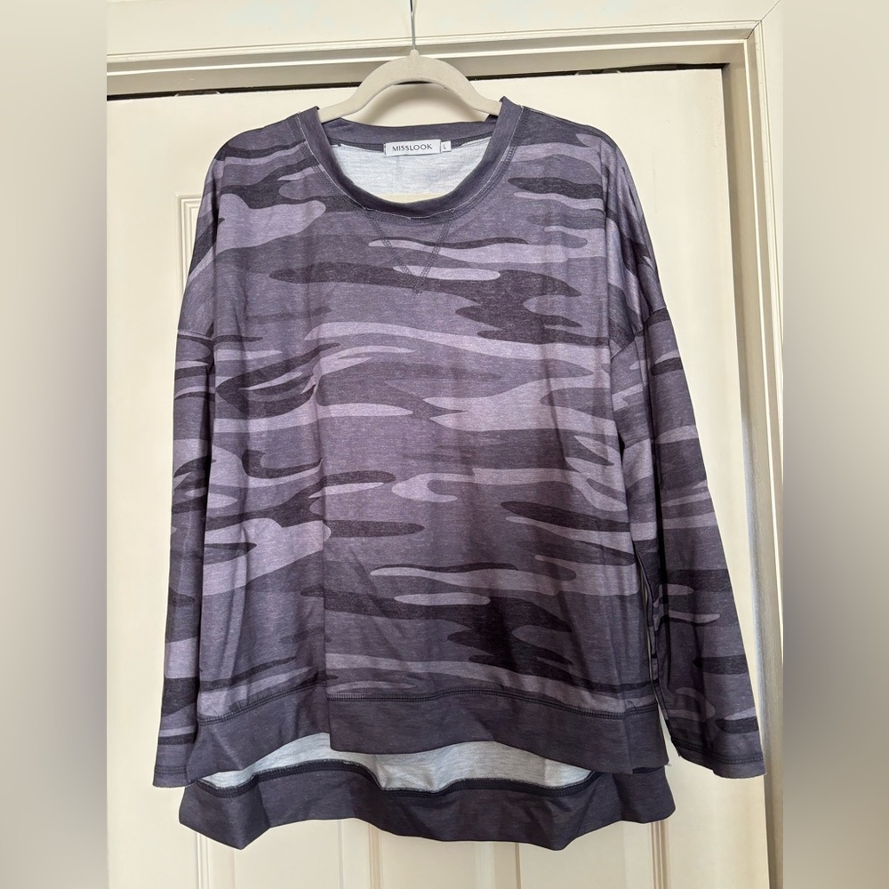 Super cute, gray camouflage top seriously soft! Never worn. Perfect shape.